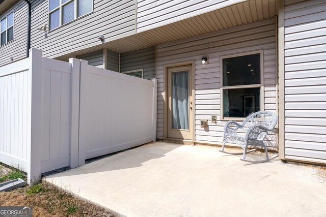 view of patio featuring fence