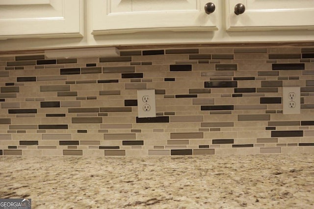 room details featuring light stone countertops