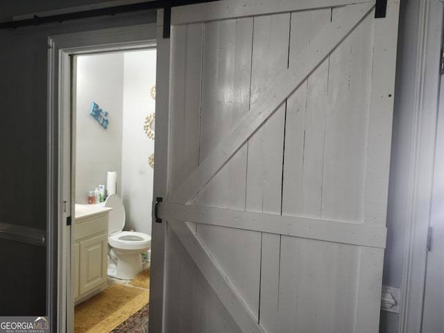 bathroom featuring toilet and vanity