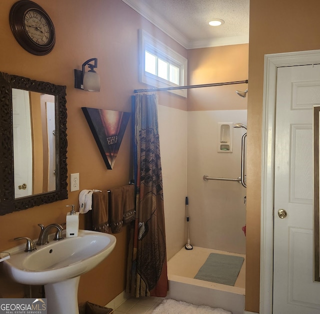 full bathroom with a textured ceiling, walk in shower, and a sink