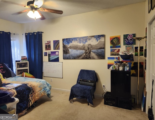 carpeted bedroom with baseboards and ceiling fan