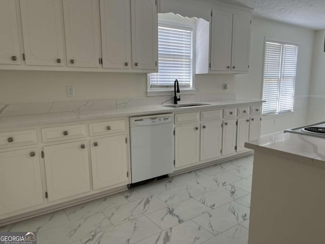 kitchen featuring marble finish floor, white cabinetry, white dishwasher, and a sink