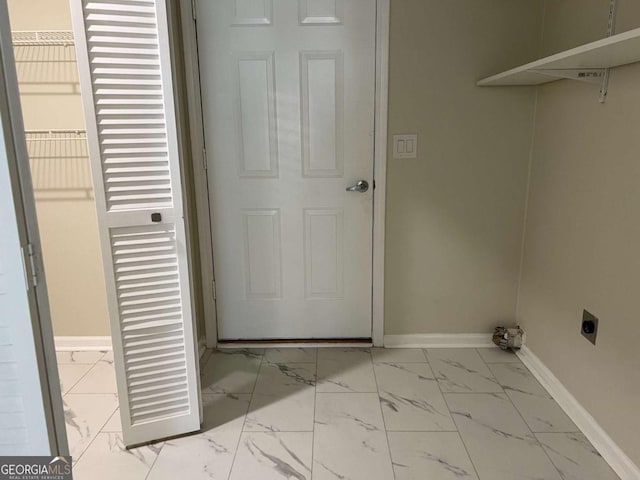 laundry area featuring marble finish floor, laundry area, baseboards, and hookup for an electric dryer