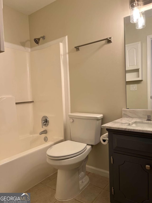 bathroom with toilet, vanity, shower / washtub combination, and tile patterned floors