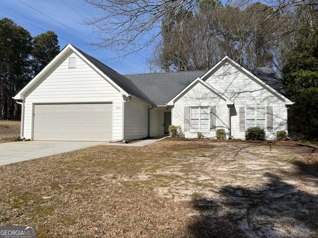 ranch-style house with a garage and driveway