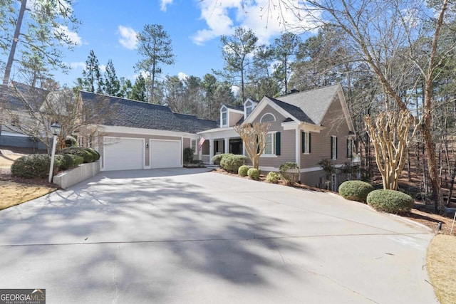 view of front of house with an attached garage and driveway