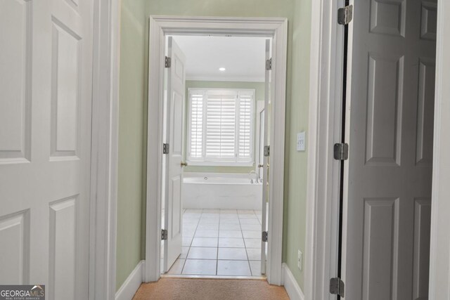 1020 Troublesome Creek Ln, Greensboro, GA 30642 - corridor featuring light tile patterned flooring, baseboards, and ornamental molding