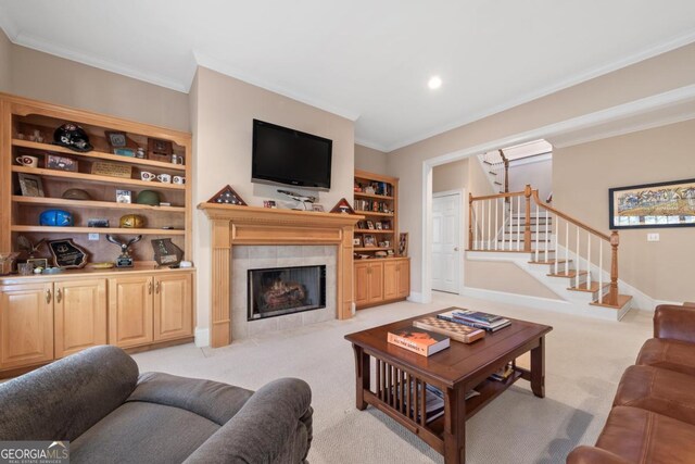 living room featuring light carpet, ornamental molding, and stairway