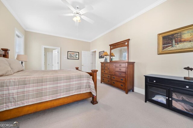 bedroom featuring light carpet, ceiling fan, baseboards, and crown molding