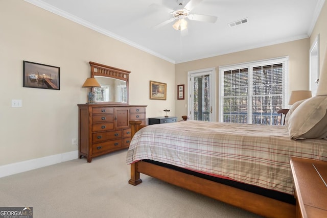 bedroom with baseboards, visible vents, light colored carpet, and ornamental molding