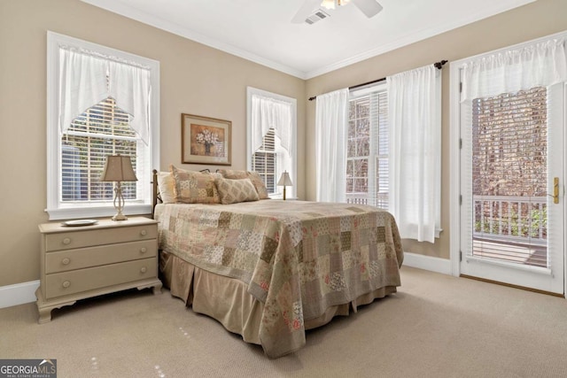 bedroom with light colored carpet, visible vents, baseboards, access to outside, and ornamental molding