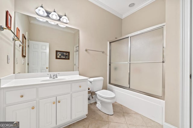 bathroom featuring shower / bath combination with glass door, toilet, ornamental molding, vanity, and tile patterned floors