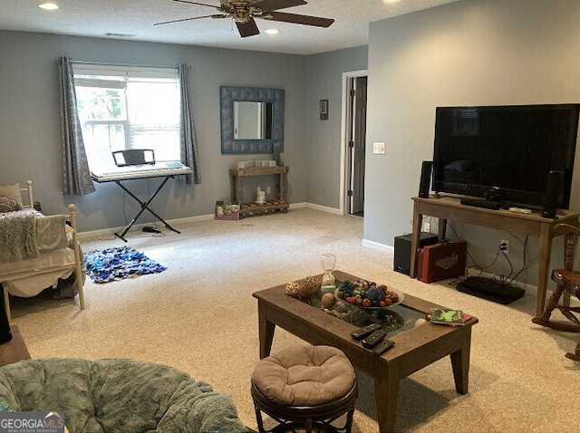 carpeted living room featuring recessed lighting, ceiling fan, and baseboards