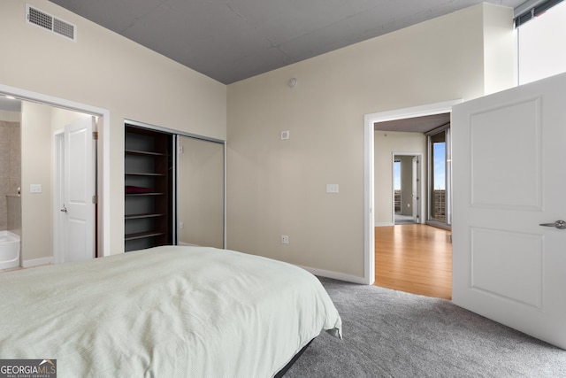 400 W Peachtree St NW Unit 3204, Atlanta, GA 30308 - bedroom featuring carpet flooring and a closet