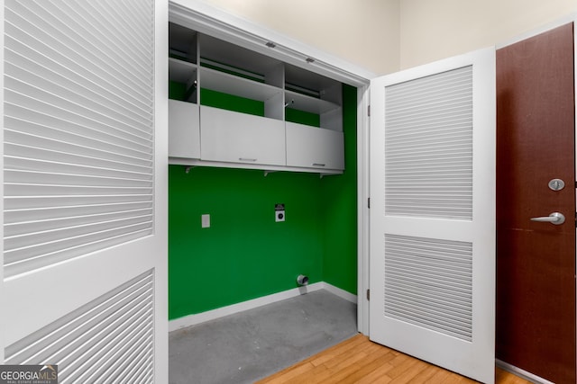 400 W Peachtree St NW Unit 3204, Atlanta, GA 30308 - laundry area with cabinet space and light wood-type flooring