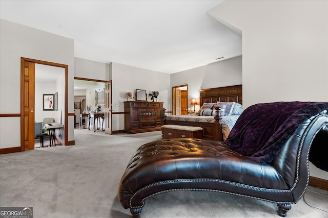 carpeted bedroom featuring baseboards