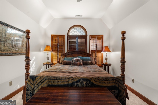 bedroom with lofted ceiling, baseboards, visible vents, and carpet flooring