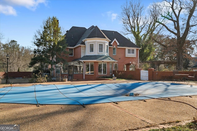 view of pool with fence, a fenced in pool, and a patio