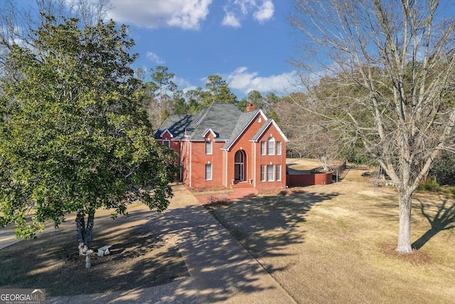 view of front of property featuring brick siding