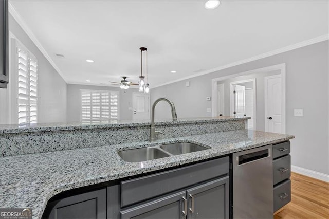 kitchen featuring crown molding, gray cabinetry, dishwasher, and a sink