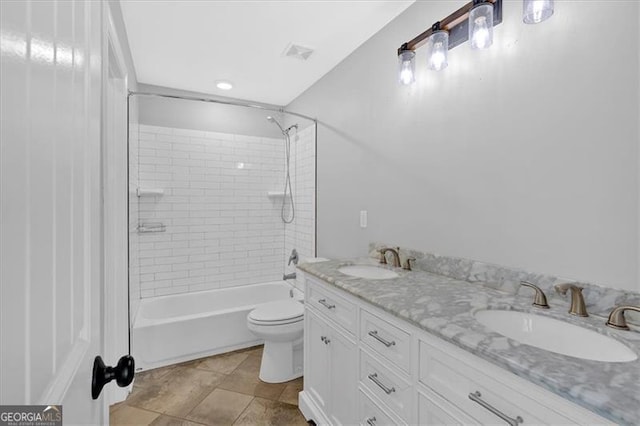 full bathroom featuring toilet, visible vents,  shower combination, and a sink