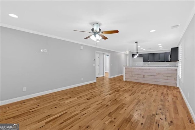 unfurnished living room with light wood finished floors, baseboards, ceiling fan, crown molding, and recessed lighting