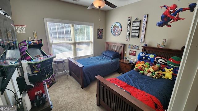 bedroom with ceiling fan, visible vents, and light colored carpet
