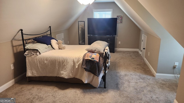 bedroom featuring vaulted ceiling, carpet flooring, and baseboards