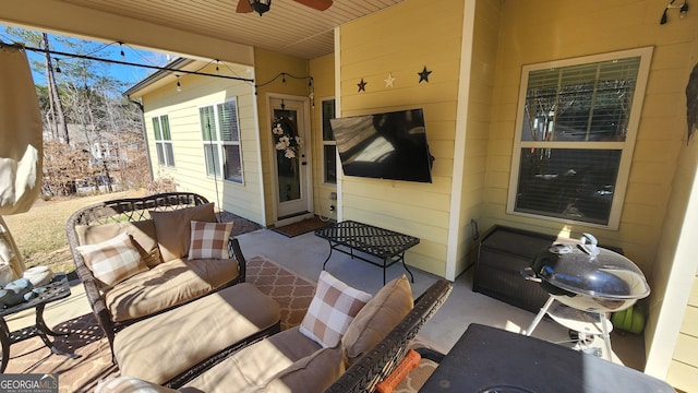 view of patio / terrace featuring ceiling fan and an outdoor living space