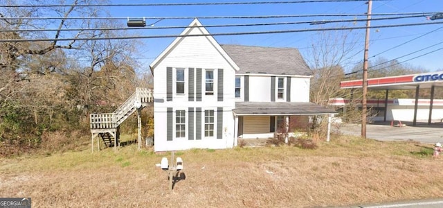 view of front of home featuring stairway