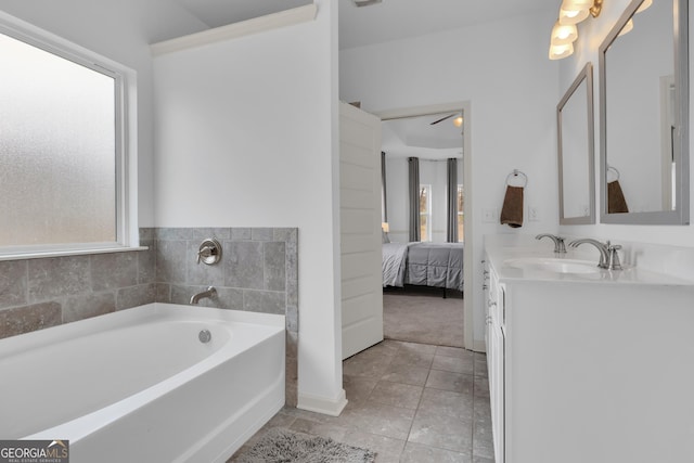 full bath with a garden tub, tile patterned flooring, ensuite bath, and a healthy amount of sunlight