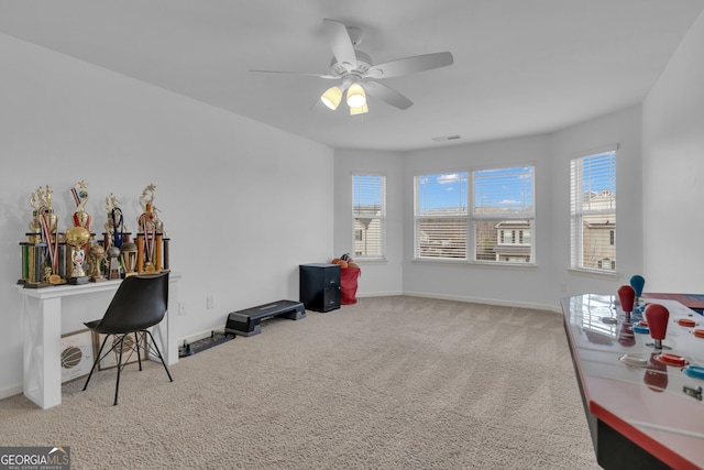 misc room with ceiling fan, carpet floors, plenty of natural light, and baseboards