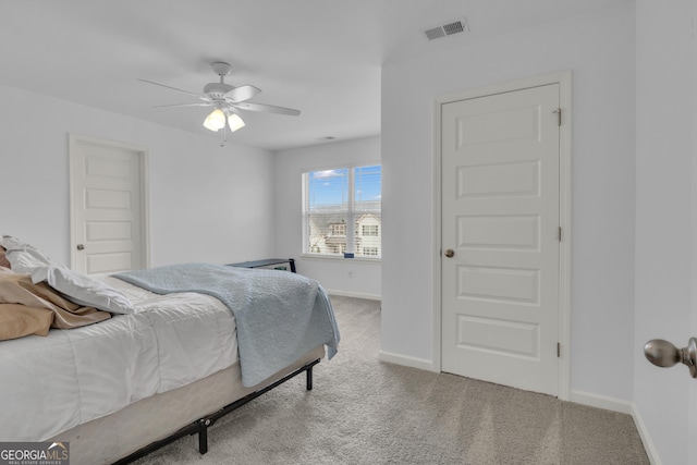 bedroom with a ceiling fan, baseboards, visible vents, and carpet flooring