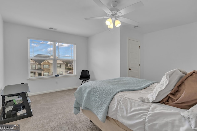 bedroom with carpet floors, baseboards, visible vents, and a ceiling fan