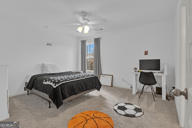 carpeted bedroom featuring ceiling fan and baseboards