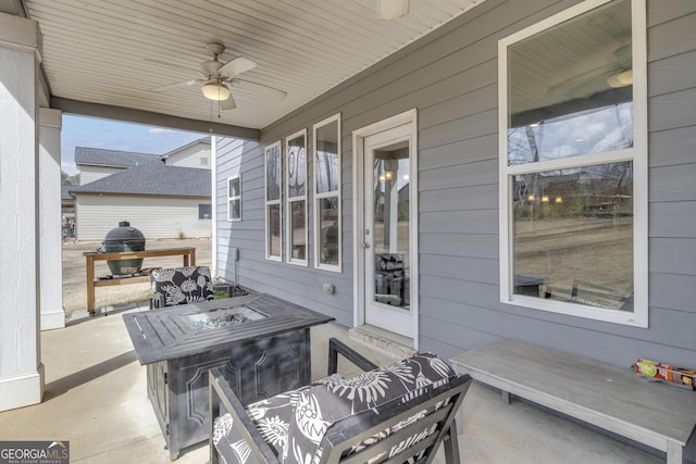 view of patio / terrace featuring ceiling fan, a fire pit, and grilling area