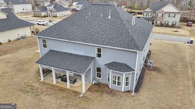 birds eye view of property with a residential view