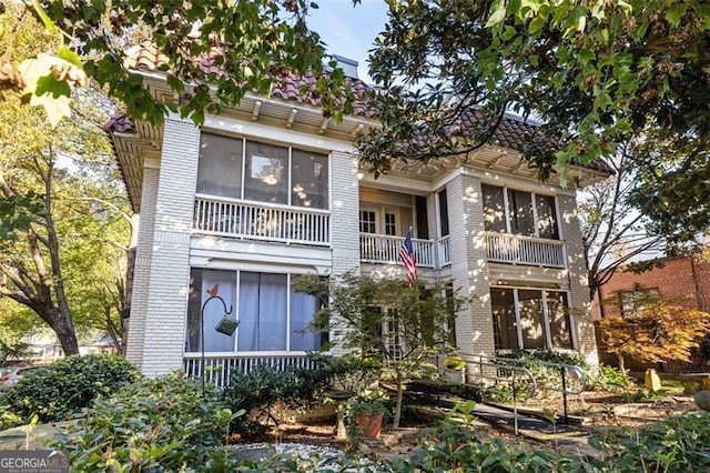 view of front of home featuring brick siding