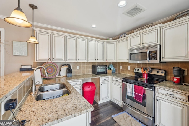 4740 Arbor Meadows Dr, Cumming, GA 30040 - kitchen featuring stainless steel appliances, visible vents, a sink, and tasteful backsplash