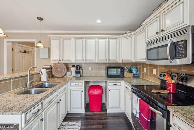 4740 Arbor Meadows Dr, Cumming, GA 30040 - kitchen with a peninsula, tasteful backsplash, appliances with stainless steel finishes, and a sink