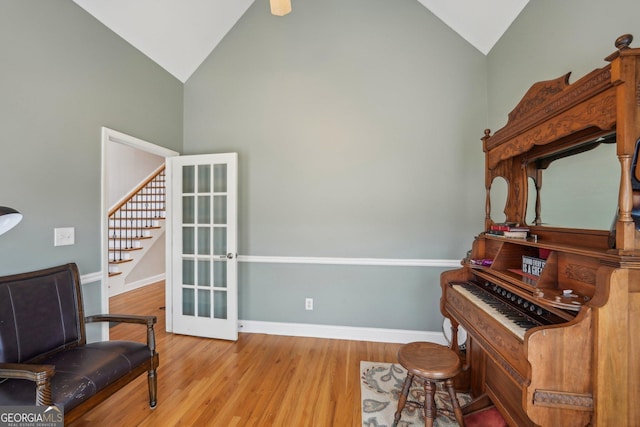 4740 Arbor Meadows Dr, Cumming, GA 30040 - sitting room with vaulted ceiling, stairway, baseboards, and wood finished floors