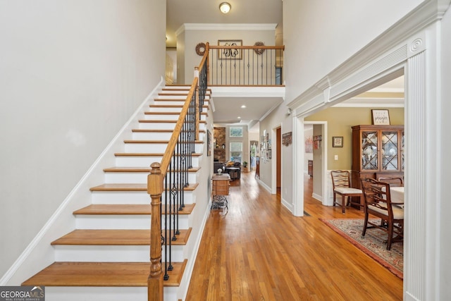 4740 Arbor Meadows Dr, Cumming, GA 30040 - foyer with a high ceiling, wood finished floors, baseboards, stairs, and crown molding