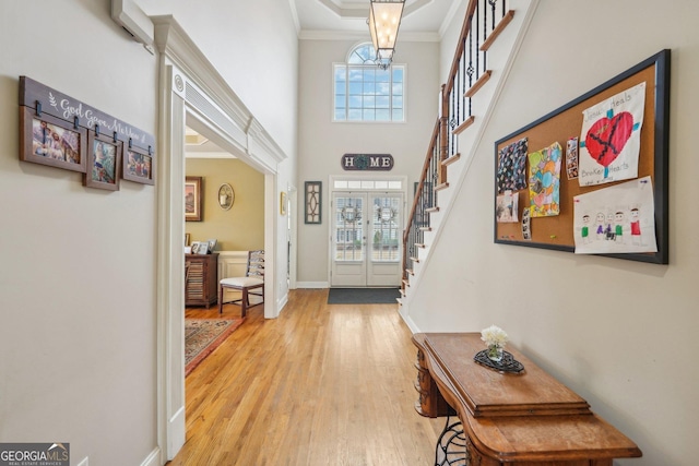 4740 Arbor Meadows Dr, Cumming, GA 30040 - entryway with a healthy amount of sunlight, light wood-type flooring, stairs, and crown molding