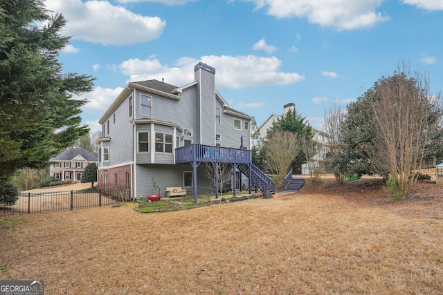 4740 Arbor Meadows Dr, Cumming, GA 30040 - back of house featuring a deck, fence, a yard, stairway, and a chimney