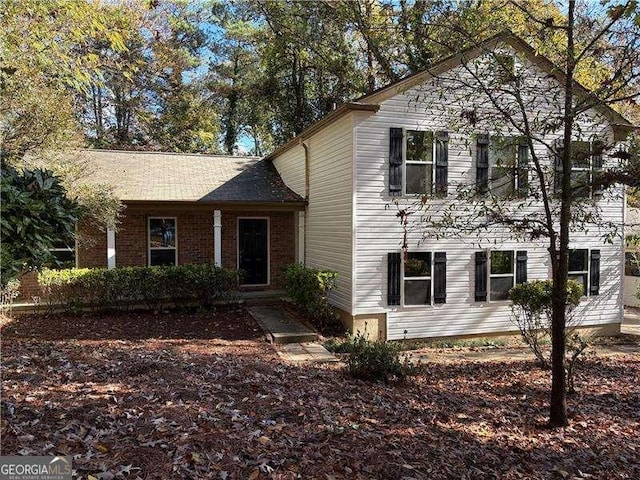 split level home featuring brick siding