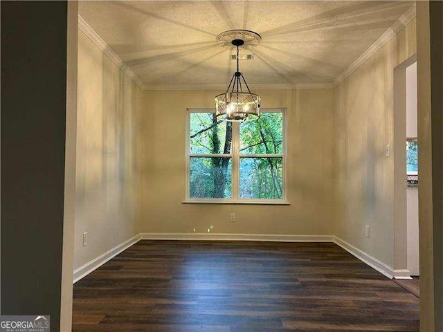 unfurnished dining area featuring dark wood-style floors, baseboards, ornamental molding, and a notable chandelier