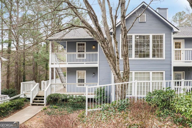 view of front of property with covered porch and a chimney