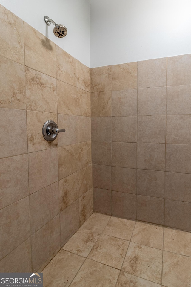 full bathroom with tiled shower