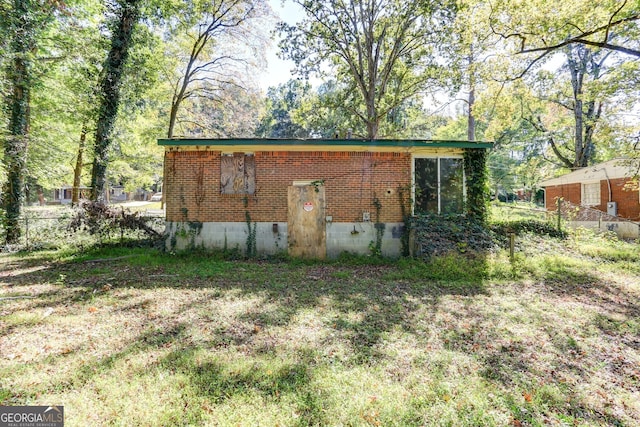 view of property exterior featuring brick siding