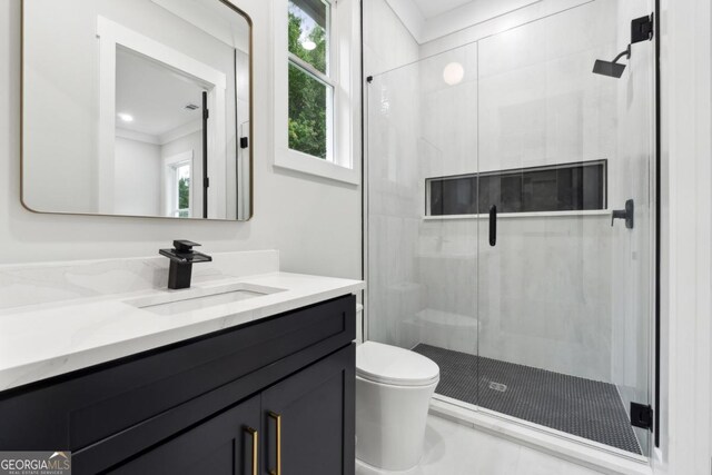 full bath with toilet, a shower stall, crown molding, and vanity